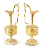 A PAIR OF LATE 19TH CENTURY FRENCH GILT BRONZE CLASSICAL EWERS ON ALABASTER BASES