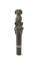 A 19TH CENTURY FRENCH FINELY CARVED EBONY AND SILVER MOUNTED WALKING CANE HANDLE