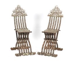 A PAIR OF 19TH CENTURY ISLAMIC OTTOMAN HARDWOOD AND MOTHER OF PEARL INLAID FOLDING CHAIRS