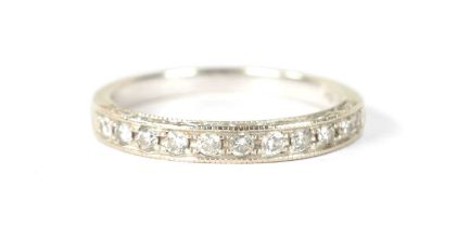 AN 14CT WHITE GOLD AND DIAMOND RING
