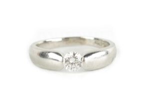 A 0.33CT TENSION SET DIAMOND AND PLATINUM RING