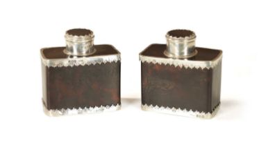 A PAIR OF EARLY 20TH CENTURY TORTOISESHELL AND SILVER MOUNTED TEA-CADDIES