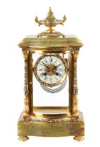 A LATE 19TH CENTURY FRENCH ORMOLU, CHAMPLEVE ENAMEL AND ONYX MANTEL CLOCK