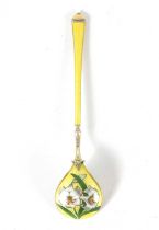 AN EARLY 20TH CENTURY SILVER GILT AND ENAMEL SPOON