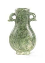 A LARGE CHINESE SPINACH-GREEN JADE TWO-HANDLED VASE