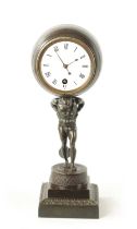 A GOOD REGENCY FRENCH BRONZE “ATLAS” MANTEL CLOCK