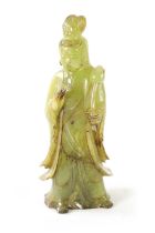 A CHINESE CARVED GREEN JADE GEISHA