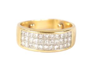 AN 18CT GOLD AND DIAMOND TRIPLE BAND RING