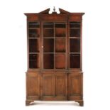 A RARE SMALL SIZED GEORGE II MAHOGANY BREAKFRONT LIBRARY BOOKCASE