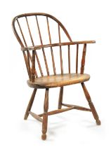A 19TH CENTURY AMERICAN PRIMITIVE STICK BACK WINDSOR CHAIR