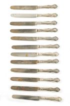 A SET OF TWELVE VICTORIAN SILVER-HANDLED TABLE KNIVES