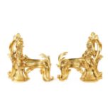 A PAIR OF 19TH CENTURY GILT ORMOLU CHENETS OF ROCOCO CHIPPENDALE DESIGN