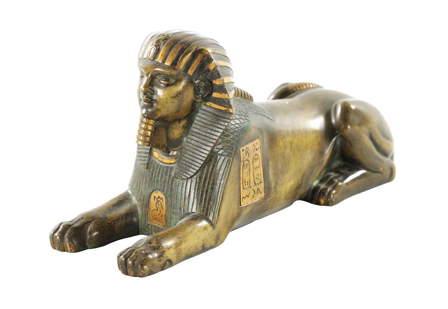 A 19TH CENTURY FRENCH EGYPTIAN REVIVAL BRONZE FIGURE OF A SEATED SPHINX