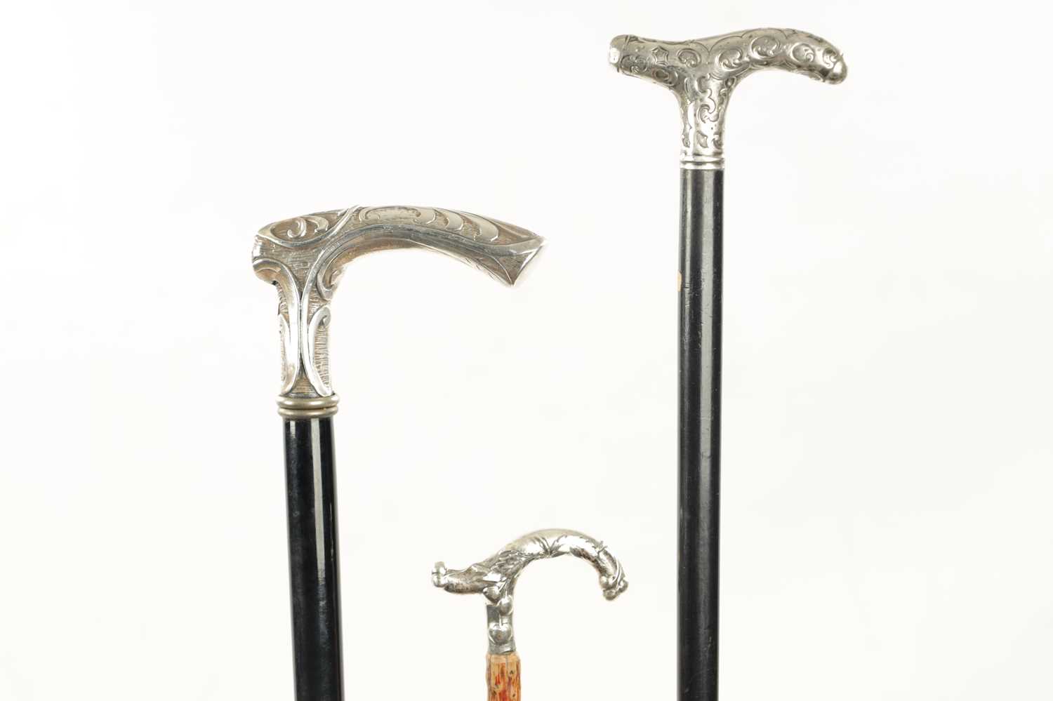 A COLLECTION OF THREE LATE 19TH CENTURY ART NOUVEAU SILVER TOPPED WALKING STICKS - Image 2 of 5