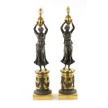 A PAIR OF REGENCY GILT AND BRONZE FIGURAL LAMP BASES