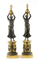 A PAIR OF REGENCY GILT AND BRONZE FIGURAL LAMP BASES