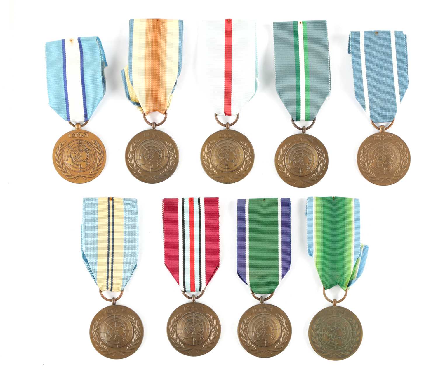 A COLLECTION OF NINE UN SERVICE OF PEACE MEDALS