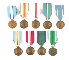 A COLLECTION OF NINE UN SERVICE OF PEACE MEDALS