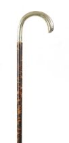 A 19TH CENTURY TORTOISESHELL VENEERED AND SILVER TOPPED WALKING STICK