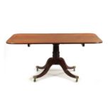 A GOOD REGENCY MAHOGANY AND EBONY INLAID PEDESTAL DINING TABLE OF LARGE SIZE