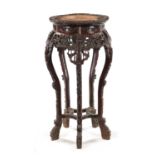 A 19TH CENTURY CHINESE CARVED HARDWOOD JARDINIERE STAND