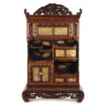 A FINE JAPENESE MEIJI PERIOD CARVED HARDWOOD SHIBIYAMA COLLECTOR’S CABINET