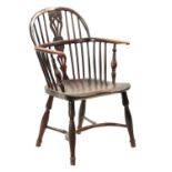 AN EARLY 19TH CENTURY YEW WOOD LOW BACK WINDSOR CHAIR