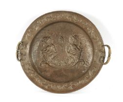 AN EARLY 18TH CENTURY SPANISH EMBOSSED BRASS TWO HANDLED DISH