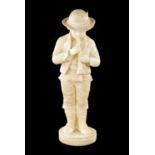 A 19TH CENTURY CARVED ALABASTER FIGURE OF A BOY PLAYING AN INSTRUMENT