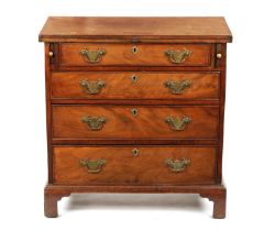 A SMALL GEROGE III FIGURED MAHOGANY BACHELORS CHEST