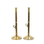 A PAIR OF LARGE 19TH CENTURY BRASS EJECTOR 'PULPIT' BRASS CANDLESTICKS