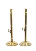 A PAIR OF LARGE 19TH CENTURY BRASS EJECTOR 'PULPIT' BRASS CANDLESTICKS