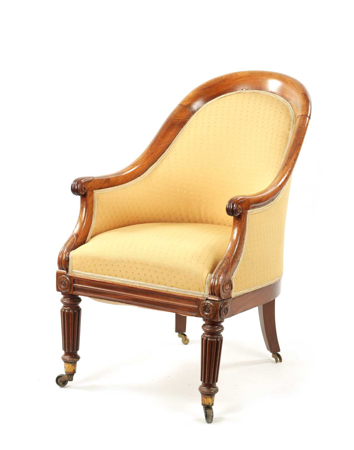 A REGENCY MAHOGANY LIBRARY TUB CHAIR IN THE MANNER OF GILLOWS