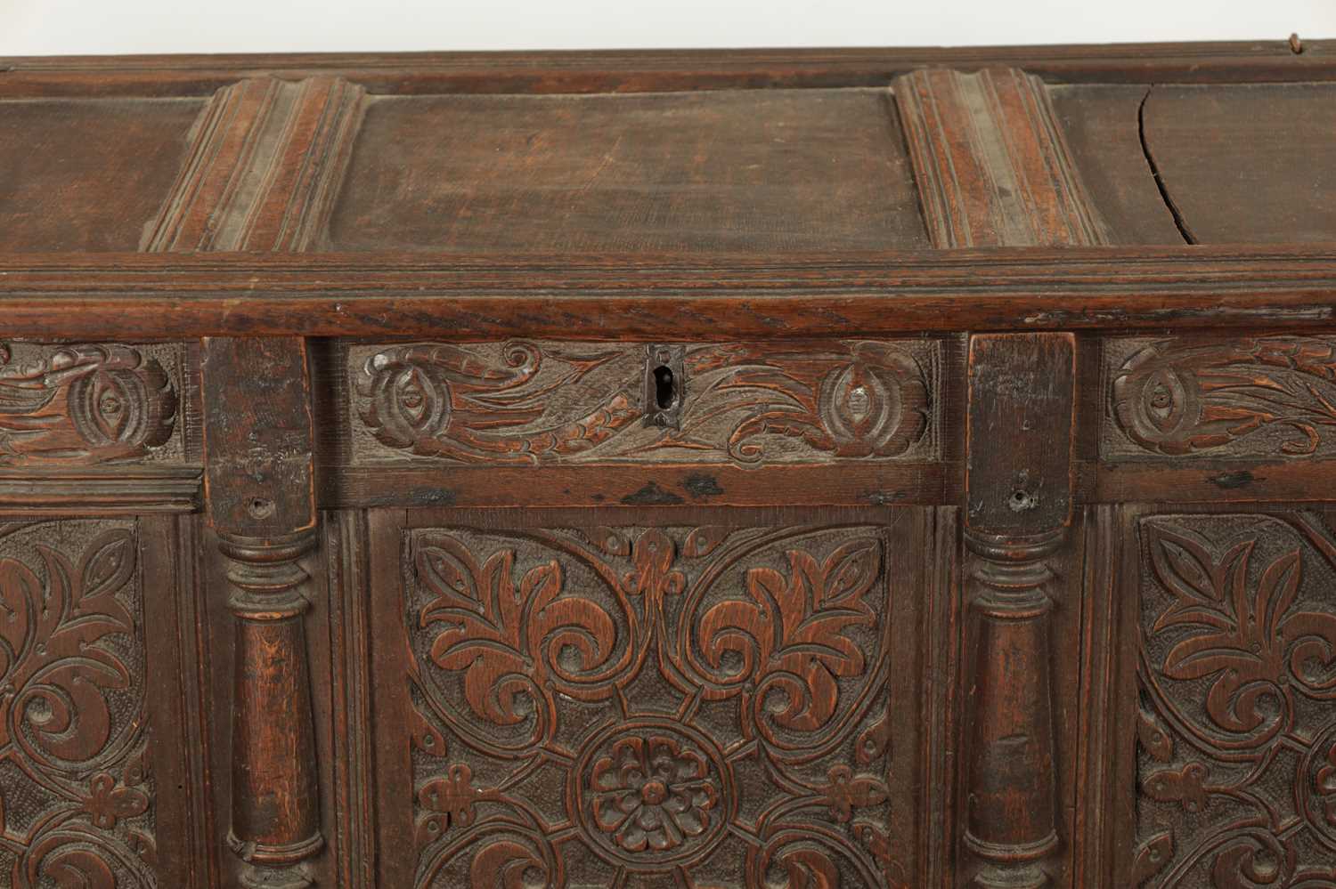 A 17TH CENTURY CARVED OAK THREE PANELLED FRONT COFFER - Image 3 of 8