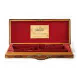 A LATE 19TH CENTURY BRASS BOUND LEATHER SHOTGUN CASE BY BOSS AND C0.