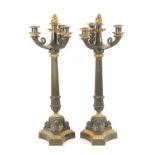 A PAIR OF REGENCY BRONZE AND ORMOLU THREE BRANCH CANDELABRA