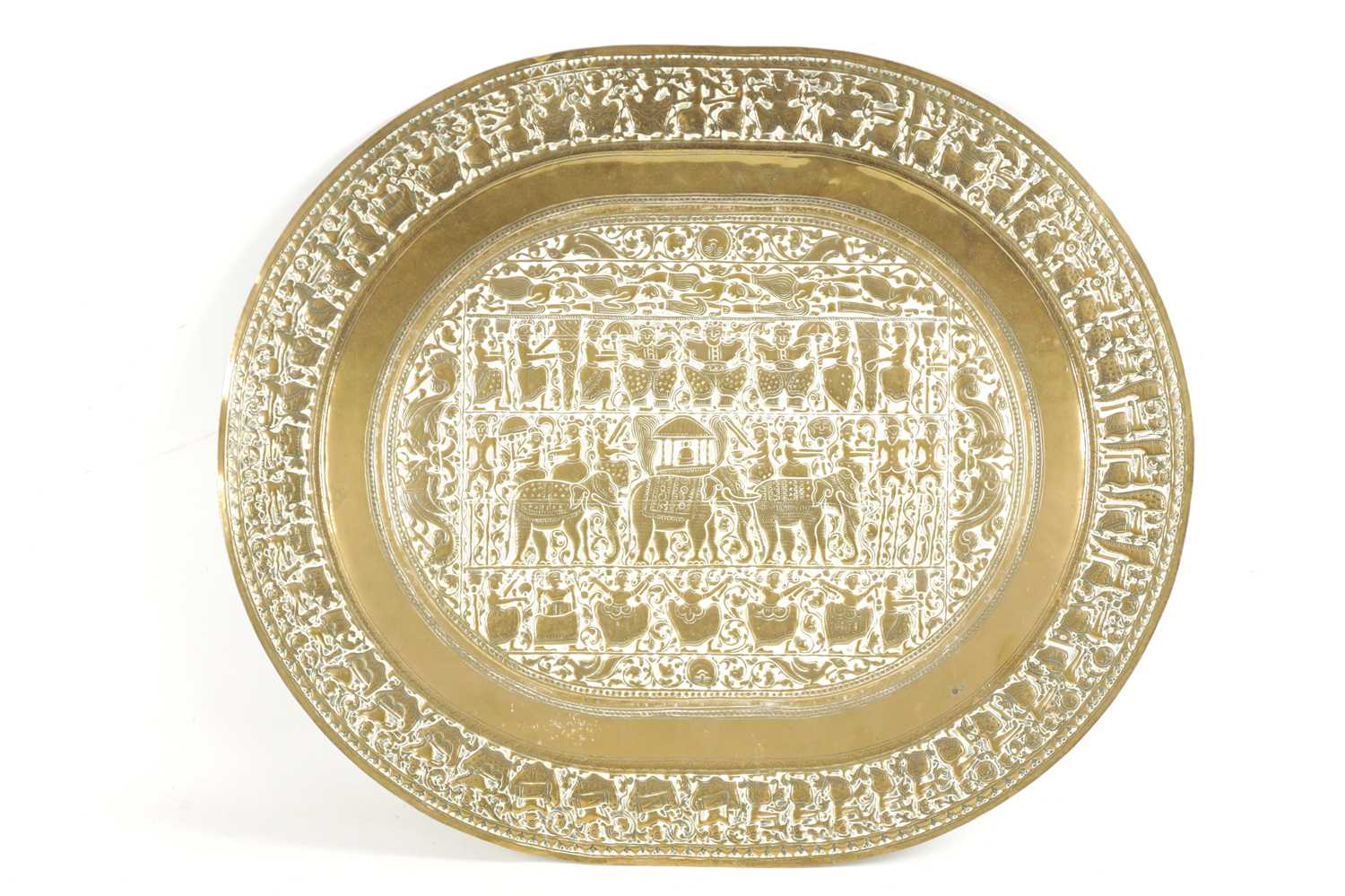 A LATE 19TH CENTURY INDIAN EMBOSSED BRASS OVAL TRAY