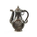 A 19TH CENTURY MINIATURE EASTERN MIXED METAL EWER