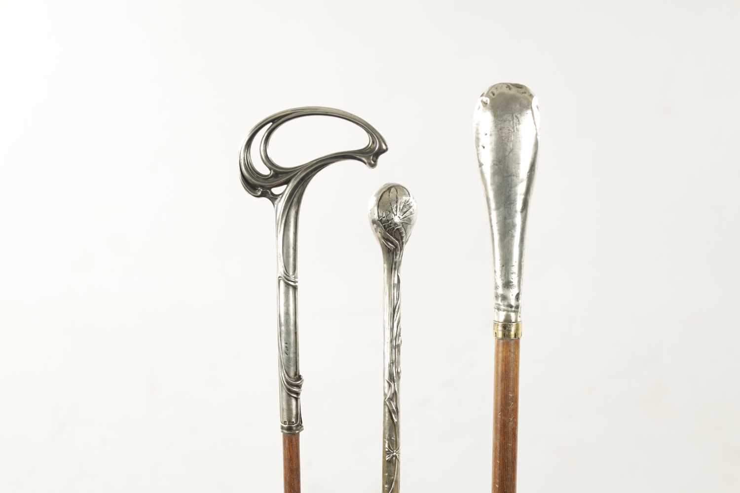 A COLLECTION OF THREE ART NOUVEAU SILVER TOPPED WALKING STICKS - Image 3 of 8