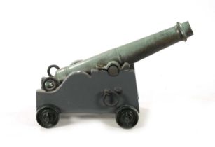 A 19TH CENTURY GREEN PATINATED SIGNALLING CANON