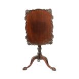 A 19TH CENTURY MAHOGANY TRIPOD TABLE IN THE GEORGE II STYLE