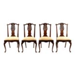 A RARE SET OF FOUR MID 18TH CENTURY OAK AND WALNUT VENEERED IRISH DINING CHAIRS WITH UNUSUAL ROCOCO