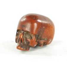 AN EARLY 19TH CENTURY CARVED BOXWOOD JAPANESE NETSUKE