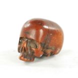 AN EARLY 19TH CENTURY CARVED BOXWOOD JAPANESE NETSUKE