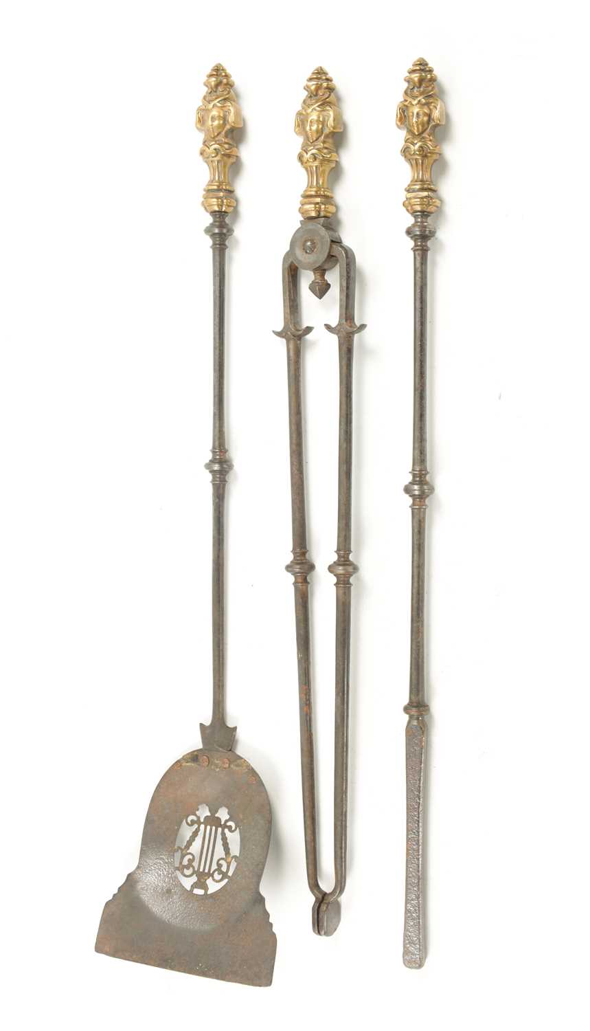 A SET OF LATE GEORGIAN BRASS AND STEEL FIRE IRONS