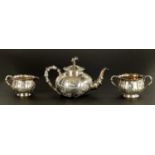 A LATE 19TH CENTURY CHINESE SILVER THREE-PIECE TEA SET