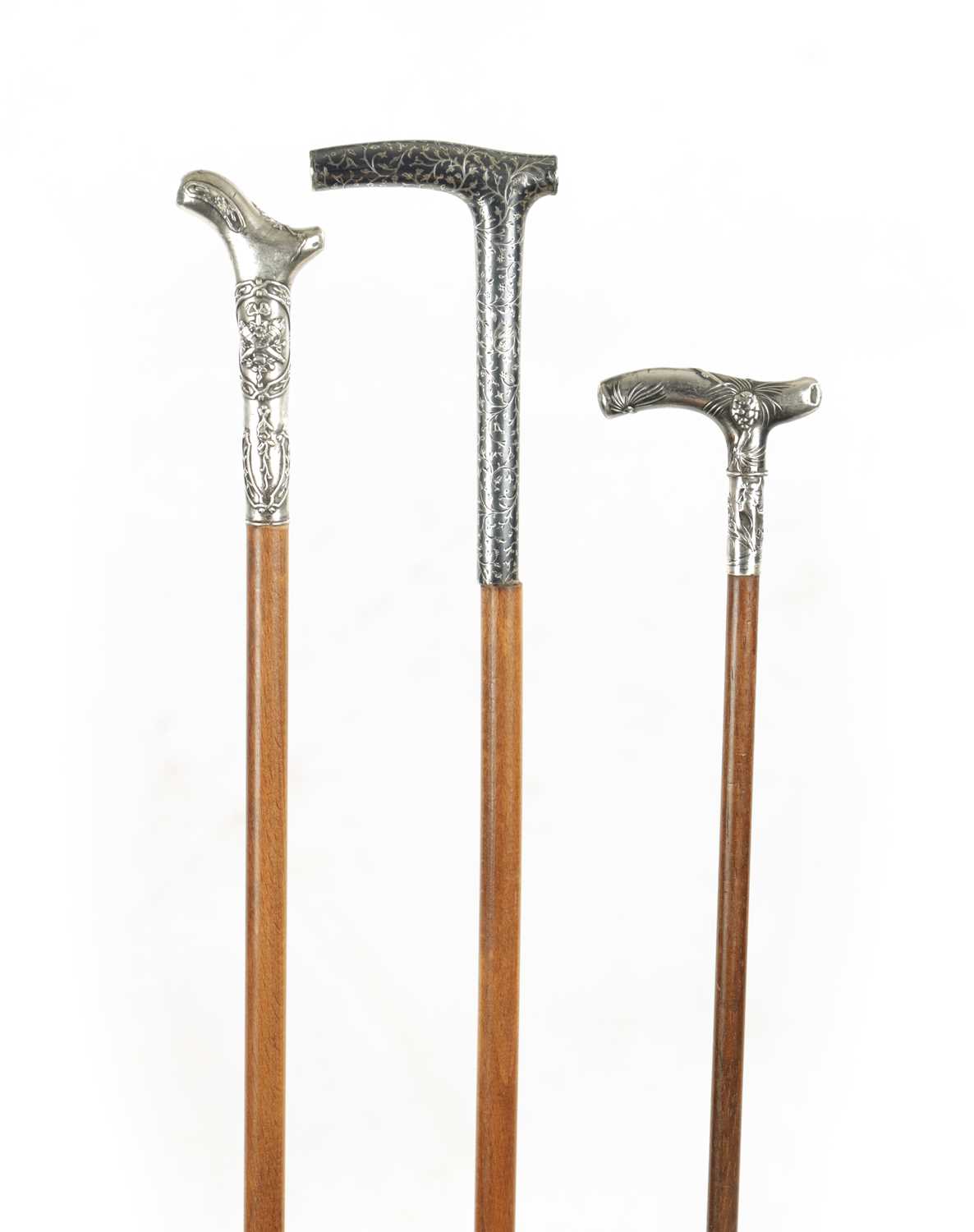 A COLLECTION OF THREE SMALL 19TH CENTURY SILVER TOPPED WALKING STICKS