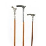 A COLLECTION OF THREE SMALL 19TH CENTURY SILVER TOPPED WALKING STICKS