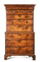 A FINE WILLIAM AND MARY FIGURED ASH CHEST ON CHEST