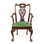 AN 18TH CENTURY WALNUT OPEN ARM CHAIR